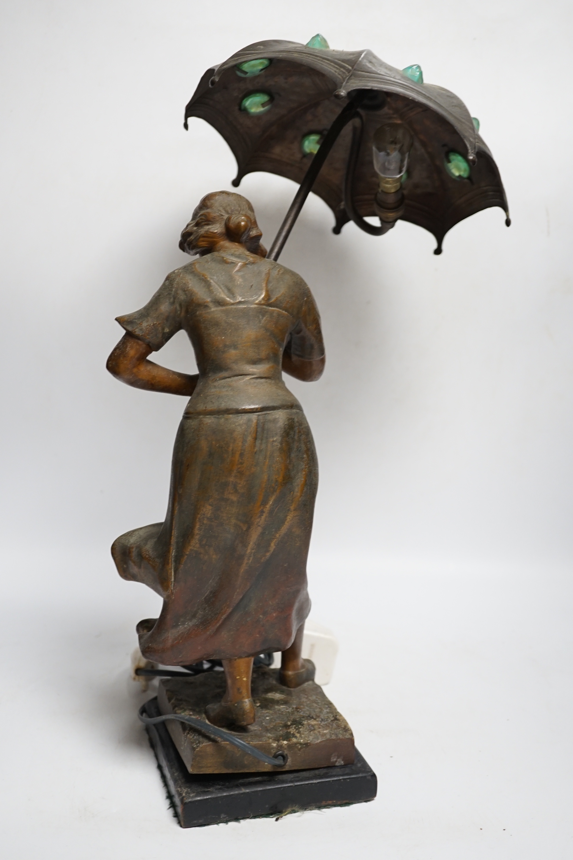 A spelter Art Nouveau-style figural table lamp, lady with an umbrella, 46cm high